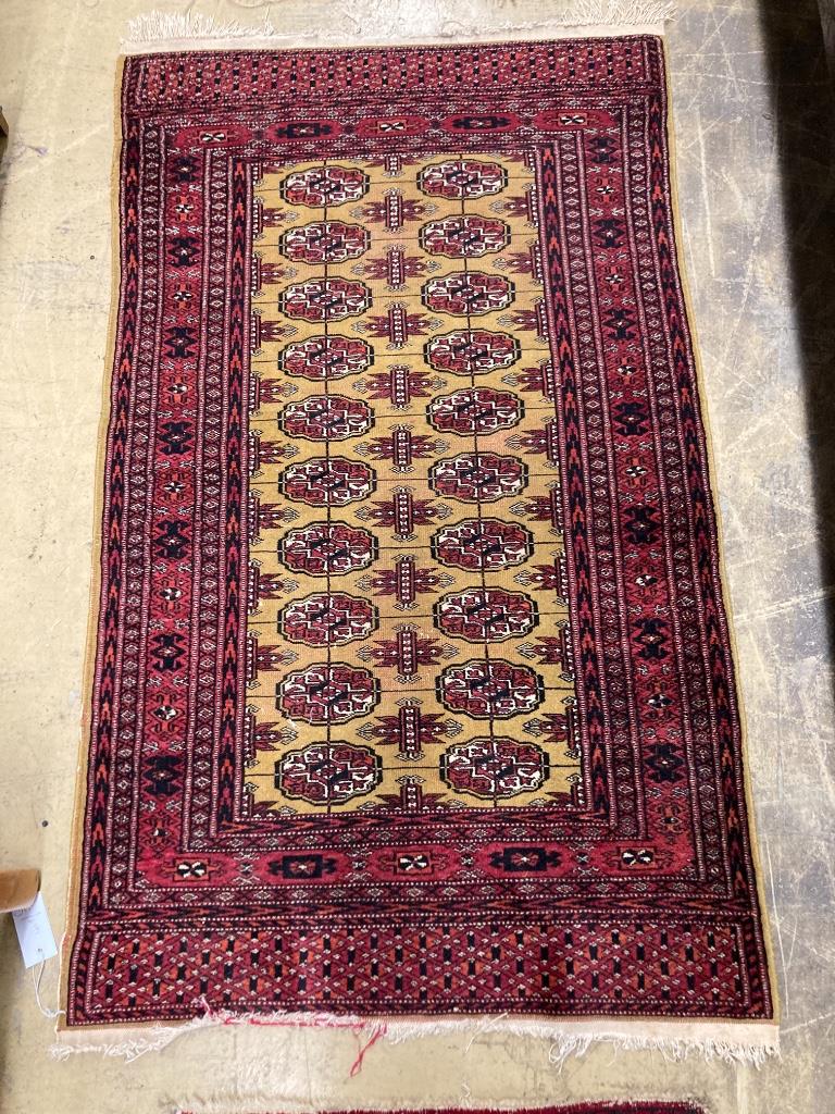 Two Bokhara rugs and a Turkish mat, largest 130 x 76cm